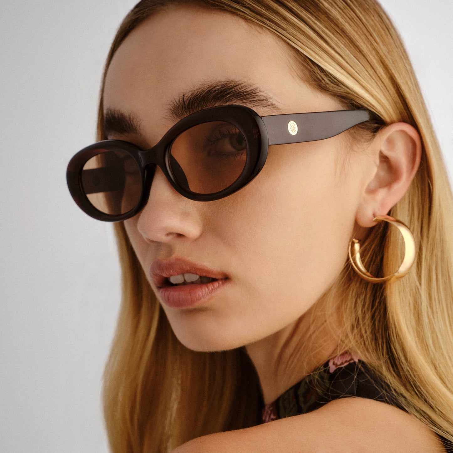 Epsilon Chocolate Female Oval Sunglasses | Aire