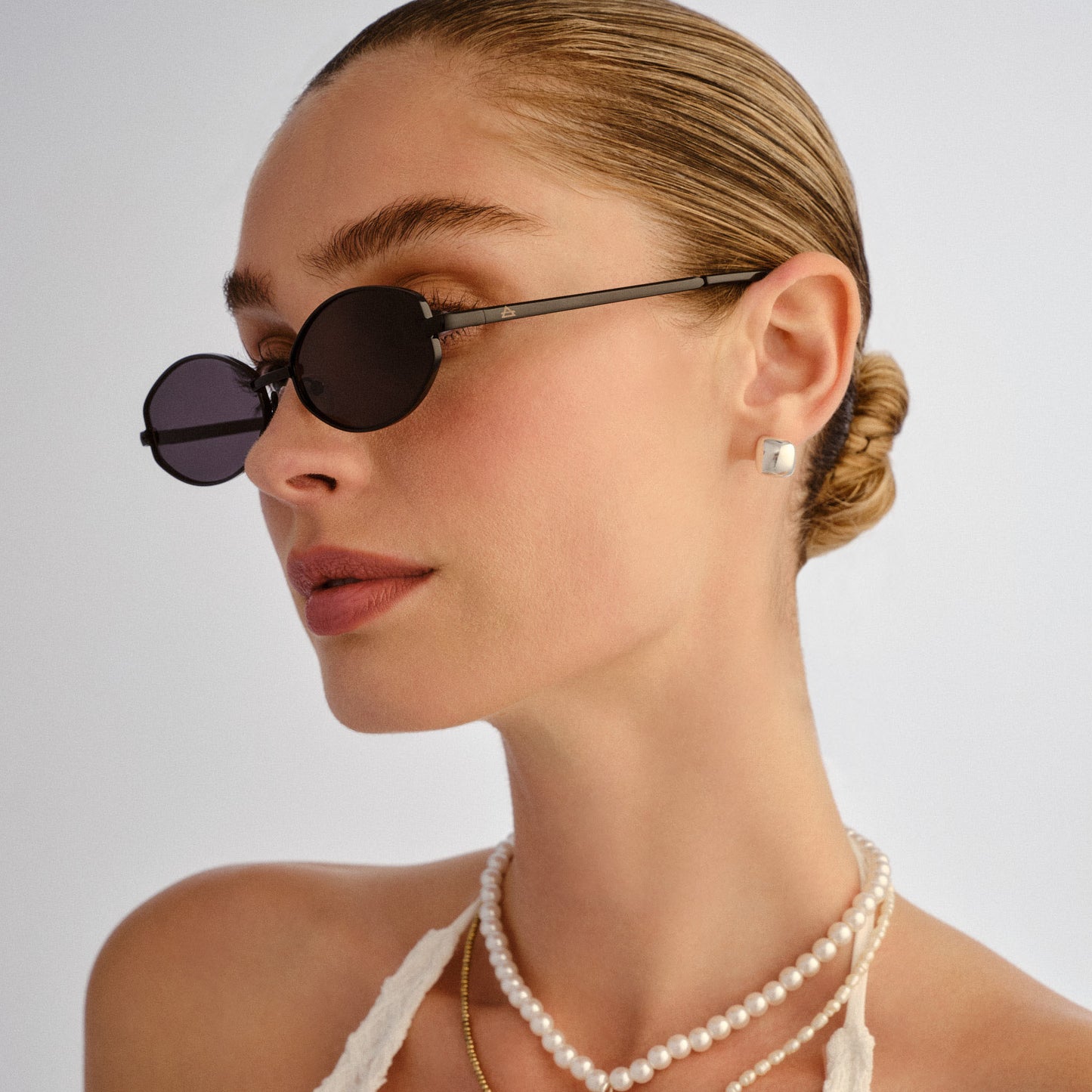 Objective Black Female Oval Sunglasses | Aire